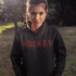 Introducing the Canada Hockey Hoodie, featuring "Hockey" in bold red and black Canadian plaid lettering—because nothing says “I’m Canadian” like plaid and hockey pride.